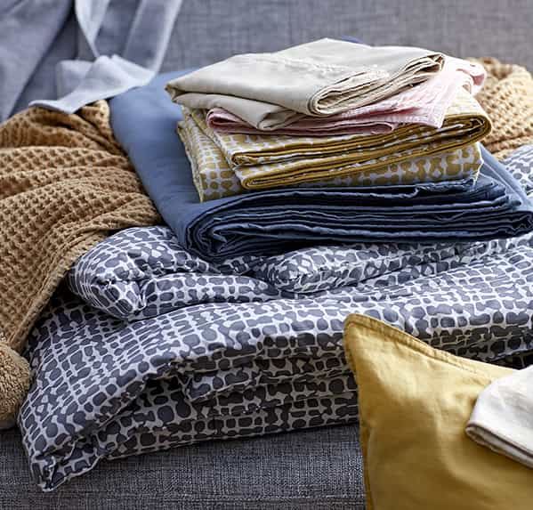 Multicolored and patterned bedding.